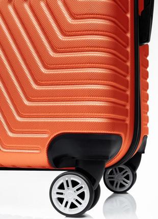 Пластикова валіза на колесах середня розмір 70l gd polo жовтогарячий4 фото
