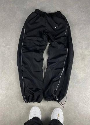 Водонепроникні нейлонові спортивні штани nike на утяжках , чоловічі , жіночі , одяг nike , штани nike oversize плащівка