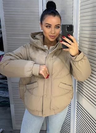 Зимова тепла куртка оверсайз крою з утеплювачем з капюшоном і кишенями збоку на...