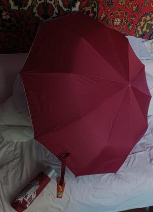 Зонт полуавтомат с городами внутри на серебряном фоне.