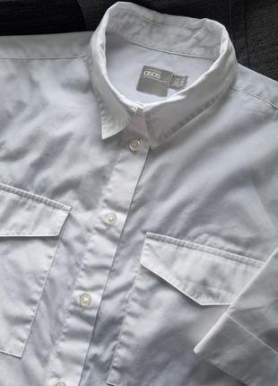 Стильова брендова жіноча біла коротка вкорочена бавовняна сорочка блуза з коротким рукавом нагрудними великими кишенями оверсайз oversize asos s xs1 фото