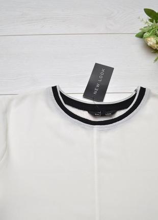 Красива чорно-біла комбінована блуза new look.4 фото