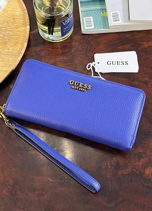 Большой кошелек из коллекции guess. модель выполнена из эко кожи1 фото