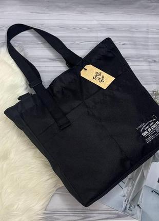 Женская черная сумка-шоппер с плечевым ремнем.4 фото