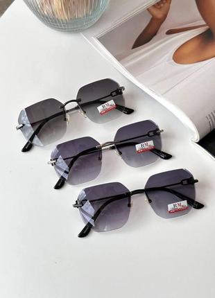Сонцезахисні класичні окуляри без оправи8 фото