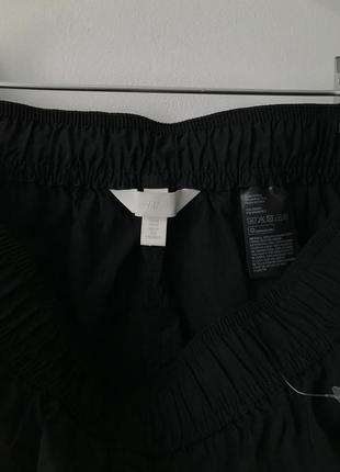 Спортивные черные шорты h&m свободные шорты черного цвета на резинке плащевка с карманами для спорта4 фото