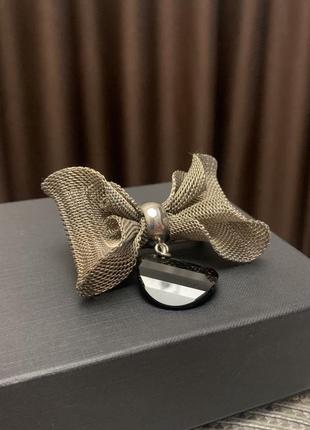 Металева брошка