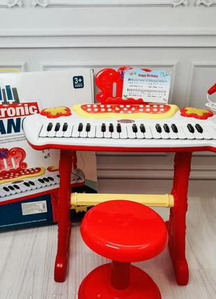 Дитячий синтезатор зі стільчиком і мікрофоном на батарейках функція запису electronic piano2 фото