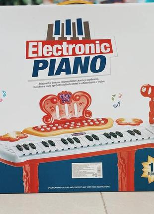 Дитячий синтезатор зі стільчиком і мікрофоном на батарейках функція запису electronic piano6 фото