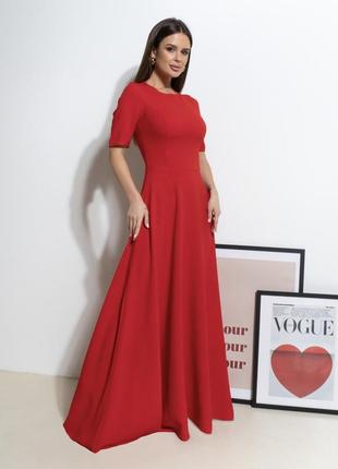 Красное длинное платье с расклешенным низом2 фото