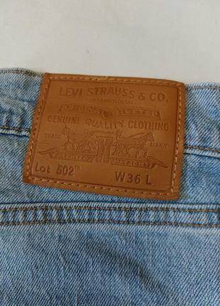 Джинсові шорти levi's 502 premium taper denim shorts5 фото