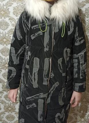 Зимняя курточка со светоотражателями черная для девочки1 фото