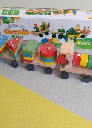 Дерев'яна іграшка кольоровий паравозик2 фото