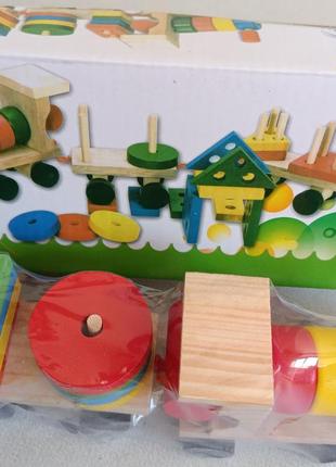 Дерев'яна іграшка кольоровий паравозик6 фото