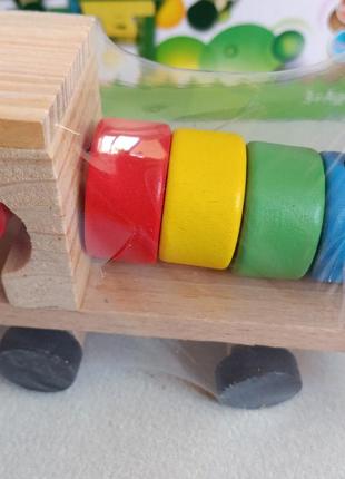 Дерев'яна іграшка кольоровий паравозик5 фото