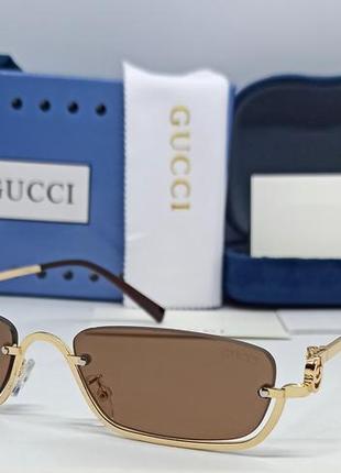 Окуляри в стилі gucci жіночі сонцезахисні вузькі модні коричневі в золотій металевій оправі