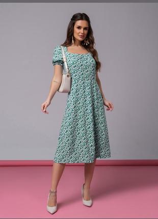 Зелене ретро плаття з кольоровим принтом і розрізом