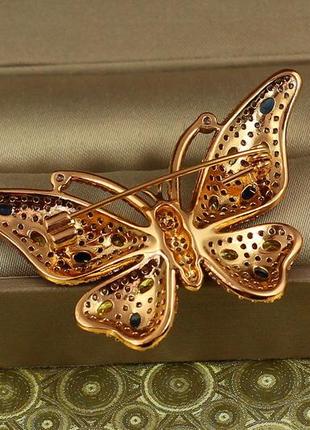 Брошь xuping jewelry бабочка с желтыми и синими камнями золотистая2 фото