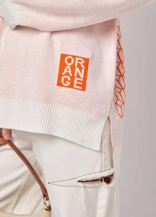 Жіночий oversize светр із принтом на спинці2 фото