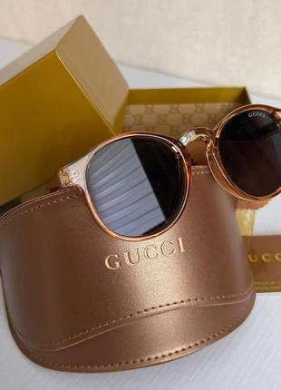 Стильні класичні жіночі окуляри gucci в золотому кольорі зі стильним чохлом3 фото