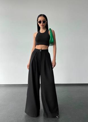 Брюки палаццо на молнии и пуговице с карманами