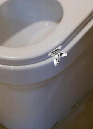 Подъемная ручка крышки унитаза