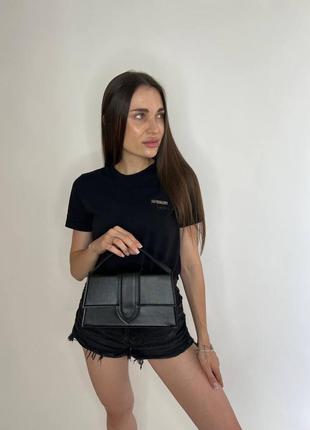 Чорна маленька жіноча сумка-кросбоді з ручкою та довгим ременем6 фото