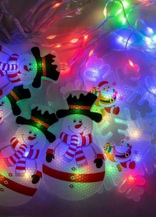 Світлодіодна гірлянда xmas штора фігурки 3d сніговика та сніжинки 3mx70cm 95l мультикольорова m2 фото