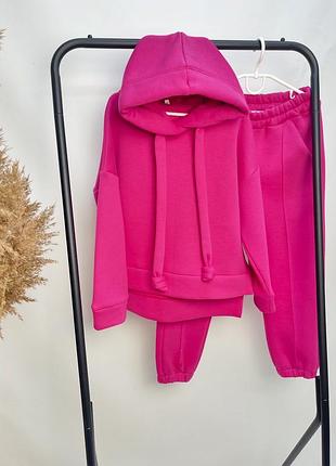 Трикотажний костюм теплий на флісі рожевий з капюшоном для дівчаток