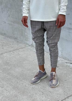 Сірі завуженні брюки чоловічі в клітку