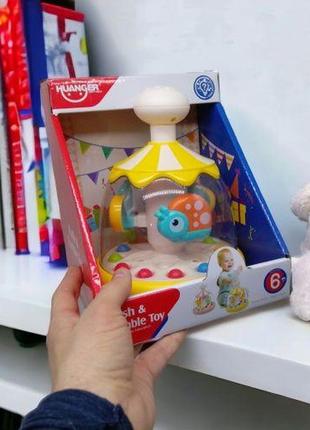 Дитяча іграшка "дзига: push & tumble toy", з кульками (жовта)2 фото
