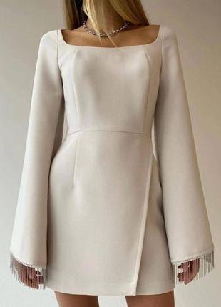 Біла сукня з бахрамою зі страз