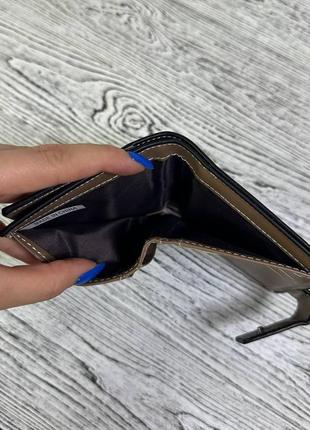 Чоловічий гаманець портмоне матеріал штучна шкіра з написом колір чорний8 фото