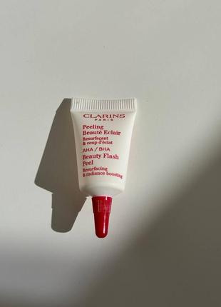 Пілінг для обличчя на основі гліколевої та саліцилової кислот clarins beauty flash peel міні 3мл1 фото