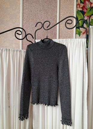 Красивий якісний сріблястий гольф з оздобленням river island.