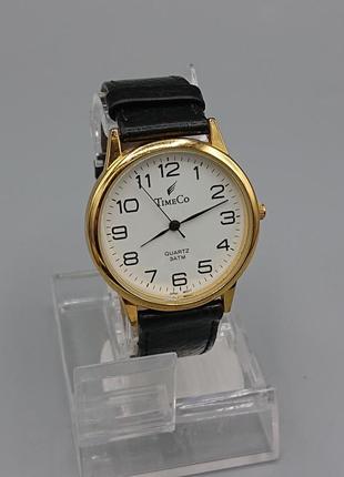 Гарний позолочений кварцевий годинник timeco