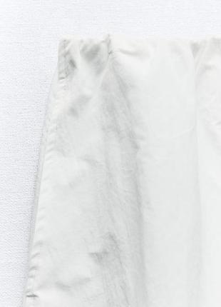 Нейлоновая юбка-балон средней длины8 фото