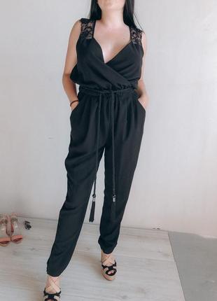 Комбинезон нарядный черный с пайетками на запах ромпер