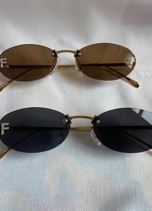 Тренд стильні жіночі чорні овальні сонцезахисні окуляри сонячні очки металева оправа6 фото