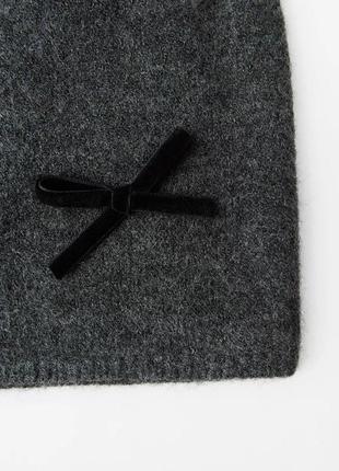 Трикотажная шапка с бантами