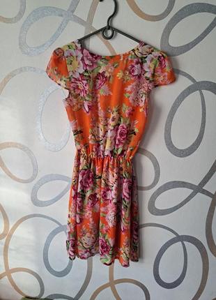 Стильное оранжевое летнее легкое яркое платье с цветами рисунком принтом2 фото