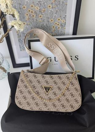 Сумка guess багет з цепью бежевий є