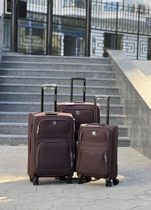 Большой чемодан дорожный тканевый l польша на колесах wings с подшипником