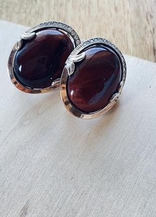 Серебряные серьги с вставкой тигровый глаз и золотом 375 пробы.