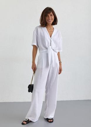 Жіночий літній білий брючний костюм жатка укорочена сорочка з гудзиками і вільні штани5 фото