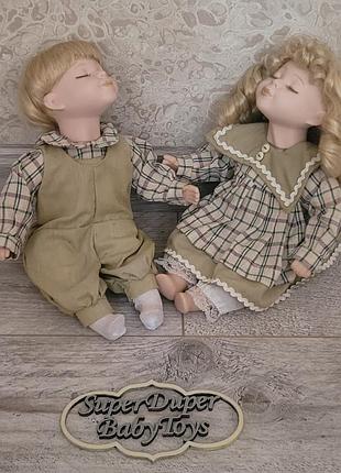 Парочка фарфоровых кукол" kissing dolls"