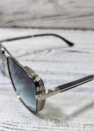 Солнцезащитные очки унисекс, голубые в  металлической серебристой  оправе ( без бренда )3 фото