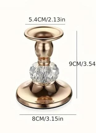 Золотистый металлический подсвечник с кристальной вставкой