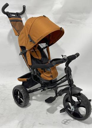 Дитячий триколісний велосипед — коляска turbo trike mt 1005-11 з батьківською ручкою жовтогарячий