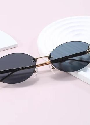 Тренд стильні жіночі чорні овальні сонцезахисні окуляри сонячні очки металева оправа3 фото